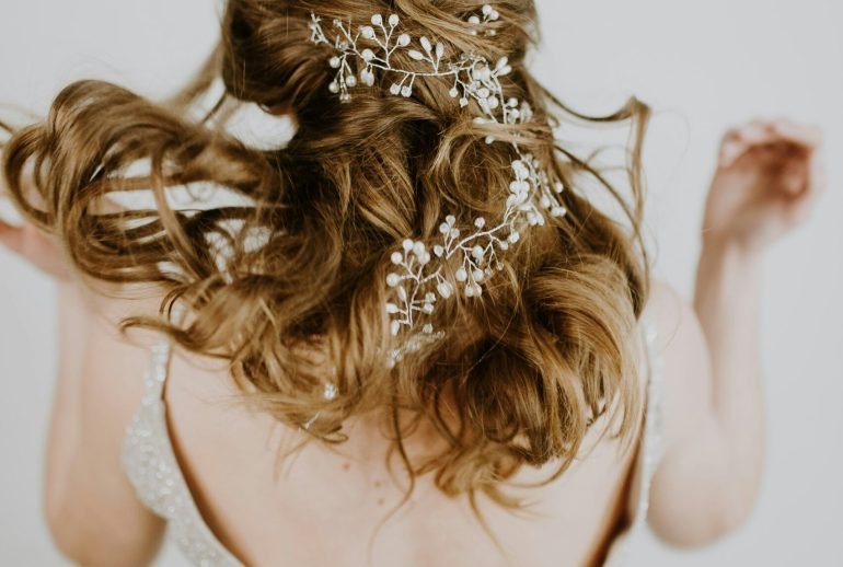 woman in beige open back sleeveless formal dress